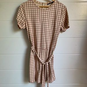 Shorts romper with red checker pattern and tie